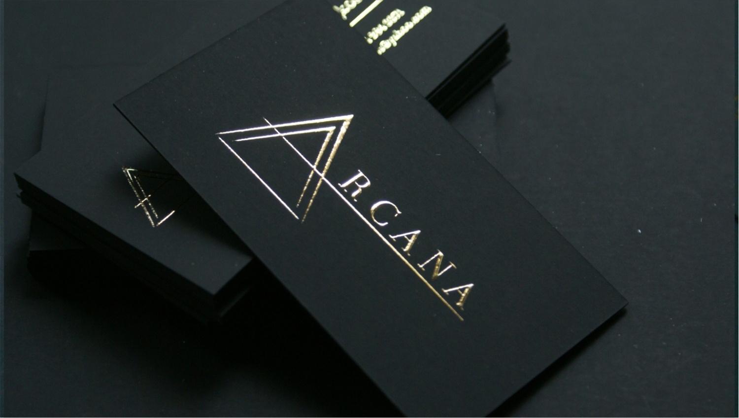 Black luxury business cards with raised gold foil stamping