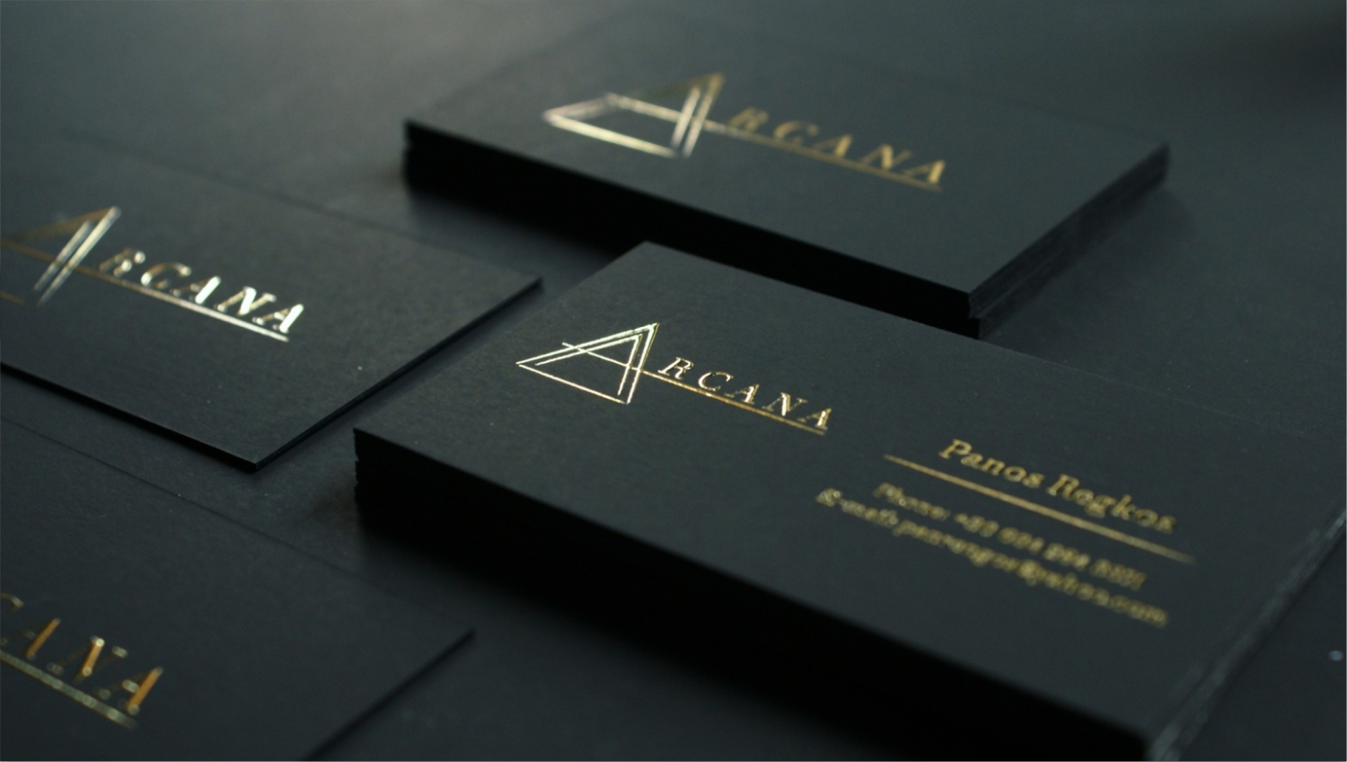 Black luxury business cards with raised gold foil stamp