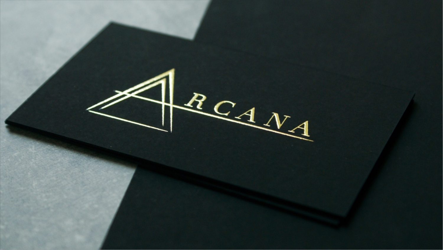 Black luxury business cards London with raised gold foil