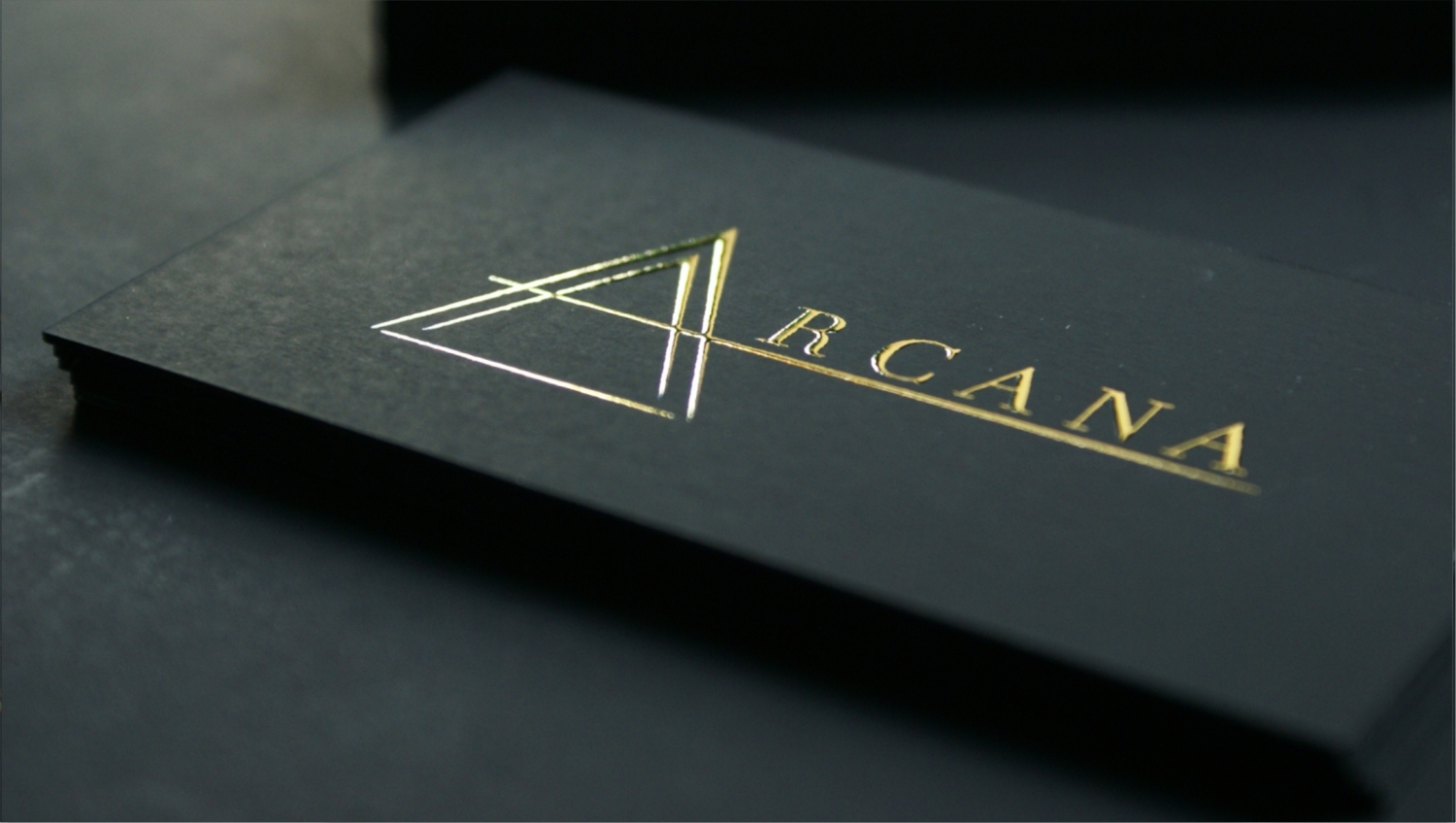 Black luxury business cards with raised gold foil